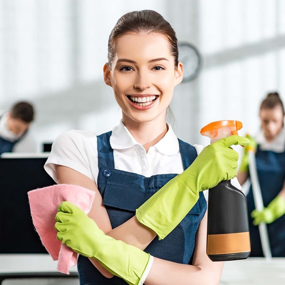 "Residential Cleaning Orlando: Emily, professional cleaner, carefully dusting furniture in a living room."